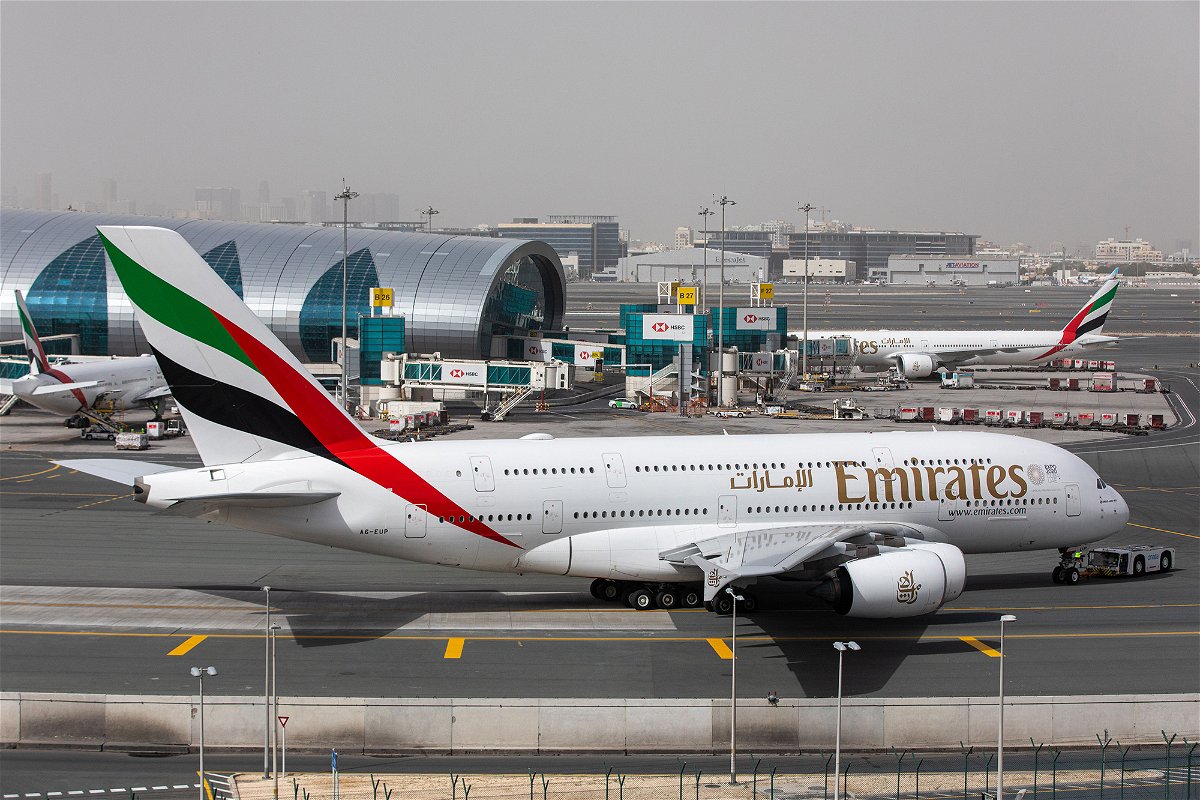 <i>Christopher Pike/Bloomberg/Getty Images</i><br/>An Airbus A380 operated by Emirates taxis past the terminal at Dubai International Airport in March 2020.
