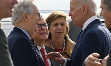 President Joe Biden greets Senate Minority Leader Mitch McConnell on arrival at Cincinnati Northern Kentucky International Airport in Hebron