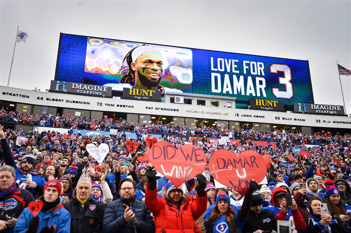 <i>Adrian Kraus/AP</i><br/>Fans stand in support for Buffalo Bills safety Damar Hamlin before an NFL football game against the New England Patriots on Sunday.