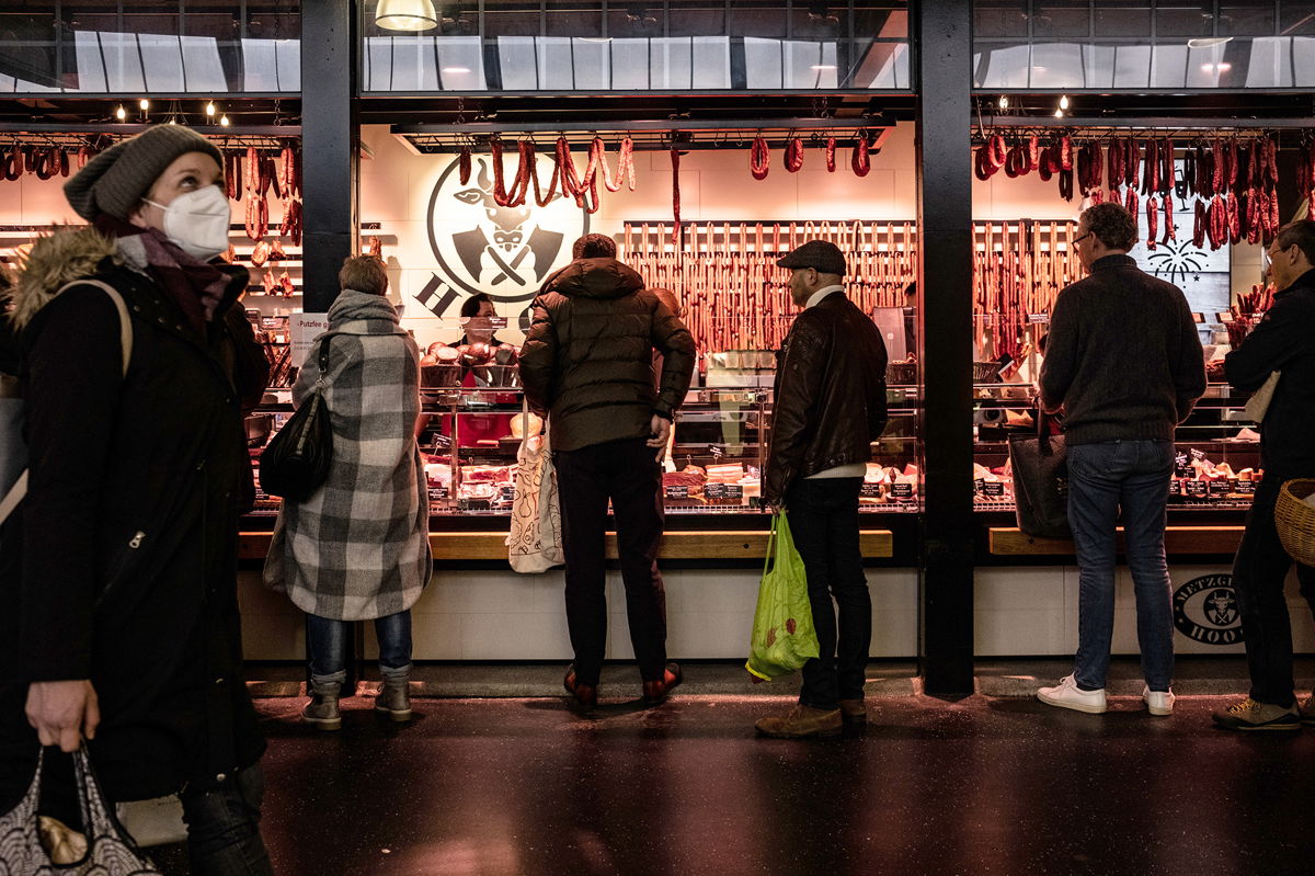 <i>Ben Kilb/Bloomberg/Getty Images</i><br/>Inflation in Europe continued to decline in December as energy prices rose at a slower pace. Customers are pictured waiting to buy products from a meat vendor in Frankfurt