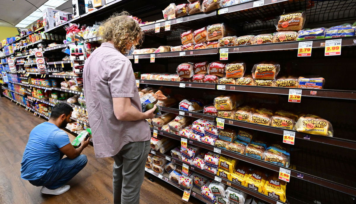 <i>Frederic J. Brown/AFP/Getty Images</i><br/>People shop for bread at a supermarket in Monterey Park