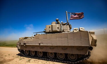 A US Bradley Fighting Vehicle patrols the countryside of the Kurdish-majority city of Qamishli in Syria's northeastern Hasakeh province
