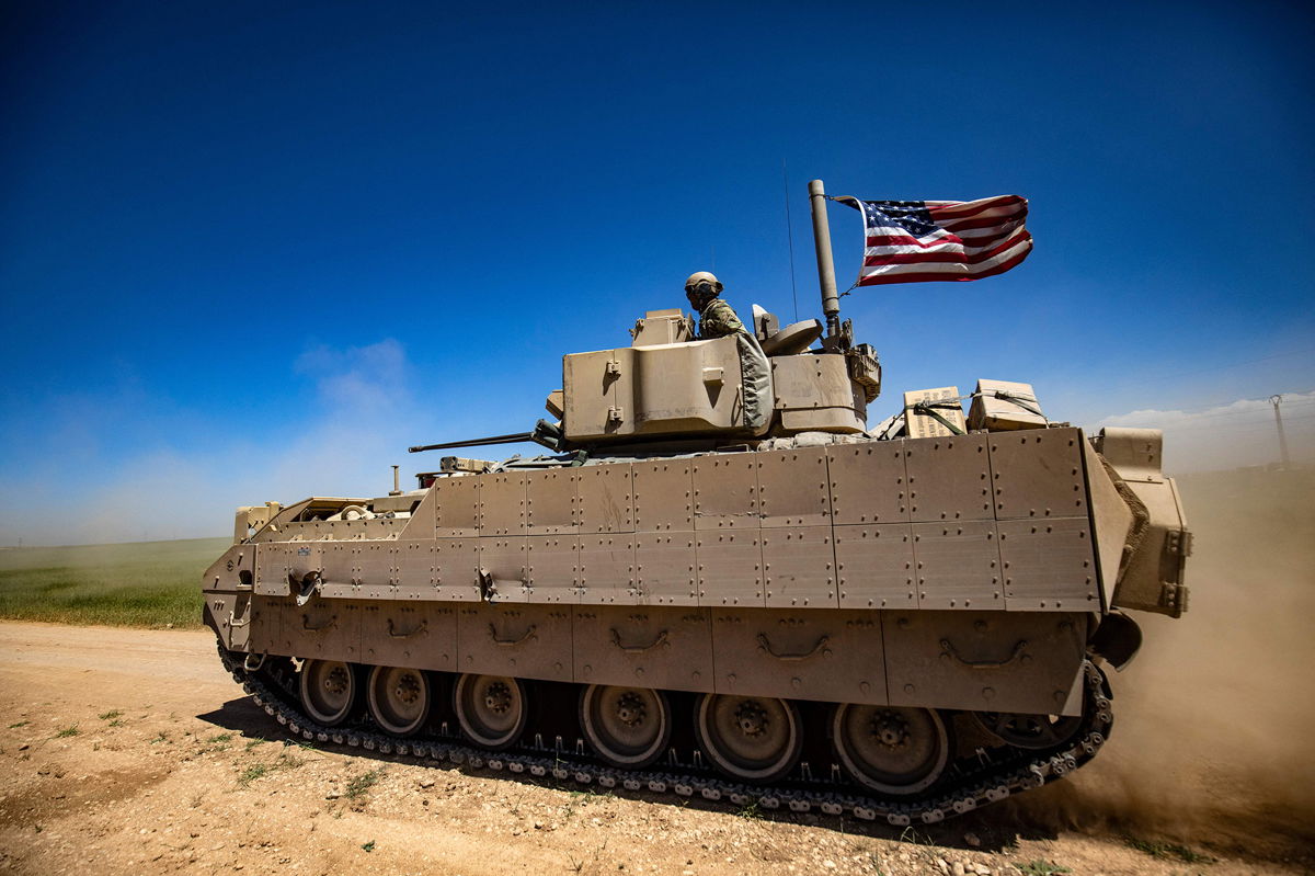 <i>Delil souleiman/AFP/Getty Images</i><br/>A US Bradley Fighting Vehicle patrols the countryside of the Kurdish-majority city of Qamishli in Syria's northeastern Hasakeh province