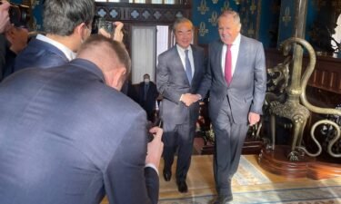 Russian Foreign Minister Sergey Lavrov and his Chinese counterpart shake hands during a meeting in Moscow on Wednesday.