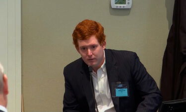 Buster Murdaugh testifies at his father's double murder trial on Tuesday. He was the third witness called by the defense