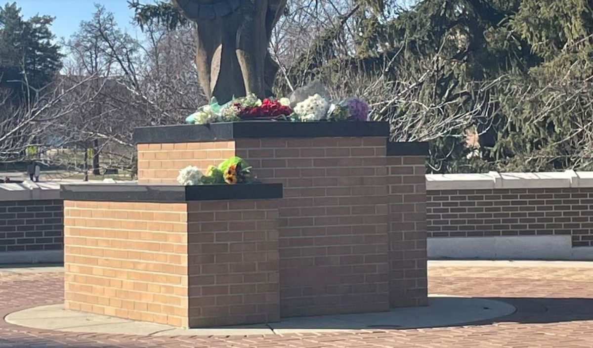 <i></i><br/>The Community rallies around each other day after a deadly mass shooting on Michigan State University’s campus. Flowers are pictured at the foot of the Spartan statue to remember the three students that were killed