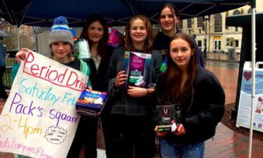 The Asheville Middle School student group called AMS Period Products took to the streets on Saturday to raise money in order to help stock their school bathrooms with menstrual products.