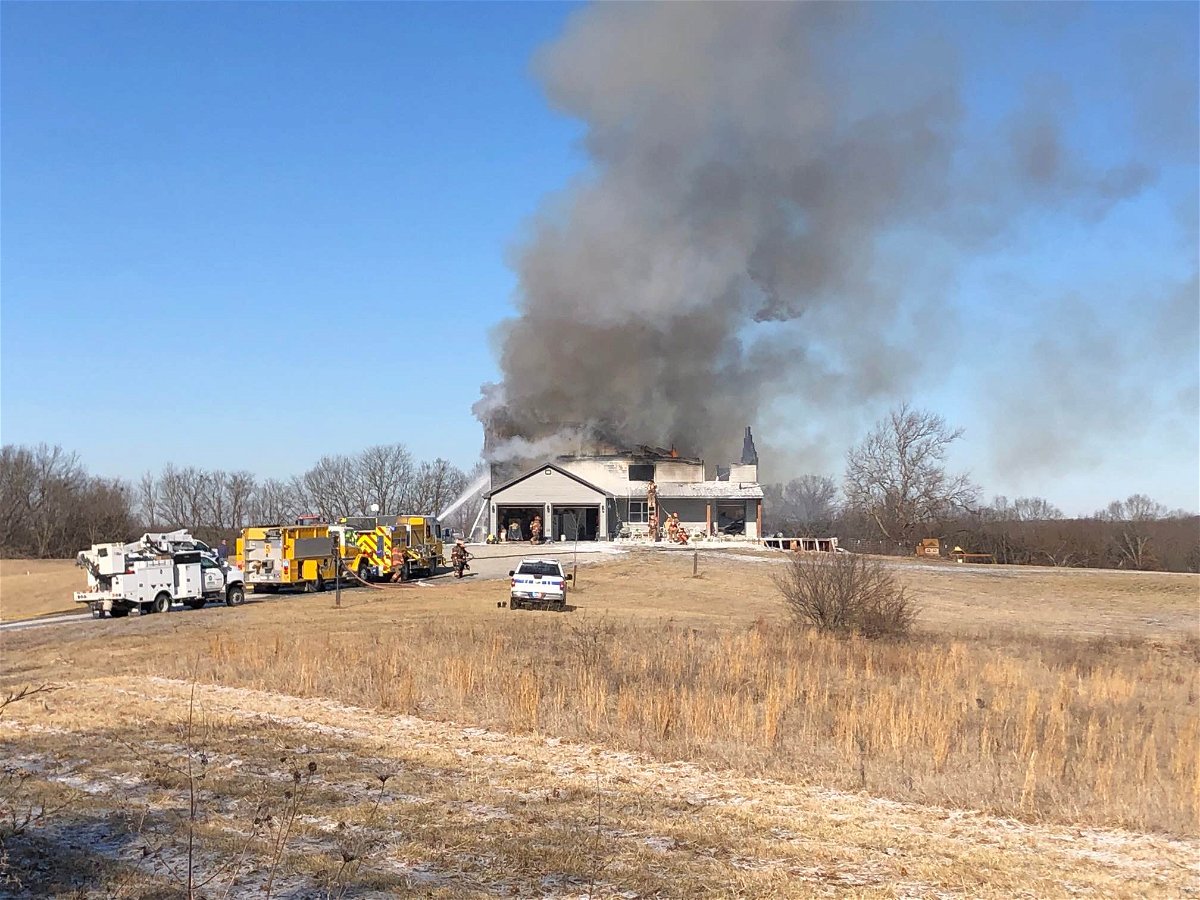 Firefighters work to save a house north of Columbia on Friday, Feb. 17, 2023.
