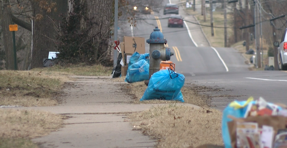 Columbia residents set trash and recycling out on the curb to be picked up.