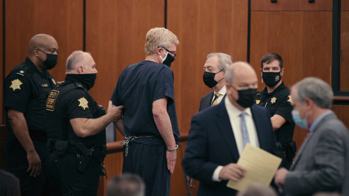 <i>Netflix</i><br/>Alex Murdaugh (center) appears in court in 