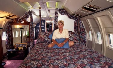 Jo Ann Ussery sits on her bed inside her converted Boeing 727.
