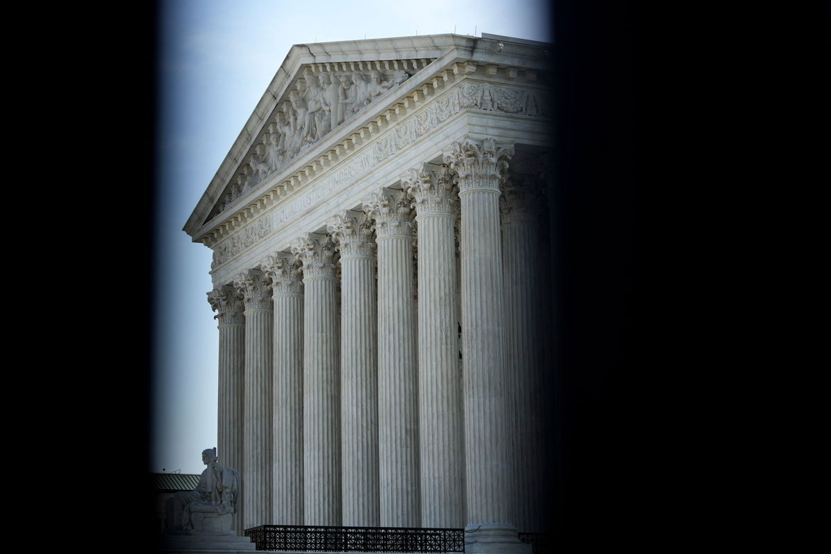 <i>Drew Angerer/Getty Images</i><br/>The US Supreme Court is seen here through security fencing in May 2022 in Washington