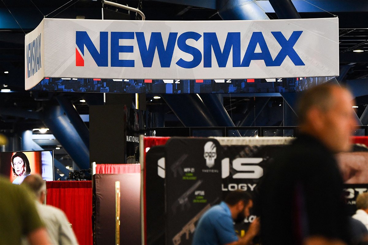 <i>Patrick T. Fallon/AFP/Getty Images/File</i><br/>Signage for the Newsmax conservative television broadcasting network is displayed at a broadcast TV booth at the National Rifle Association (NRA) annual meeting at the George R. Brown Convention Center