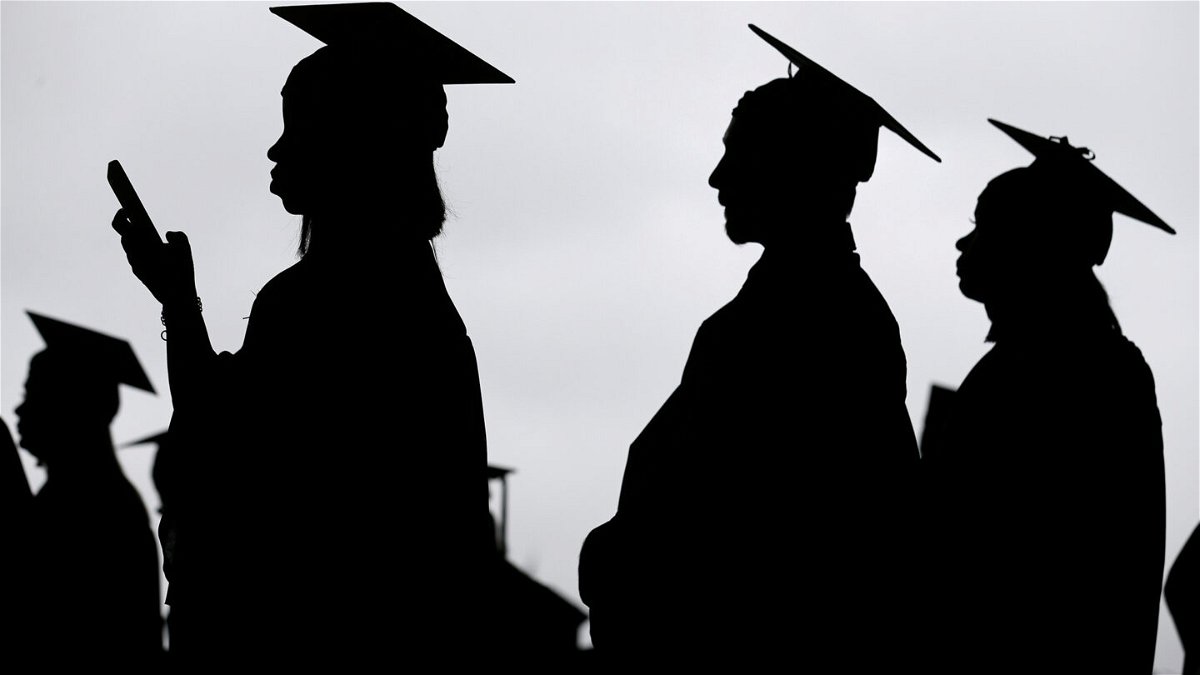 <i>Seth Wenig/AP</i><br/>President Joe Biden's student loan forgiveness plan goes before the Supreme Court Tuesday. New graduates line up before the start of a community college commencement in East Rutherford