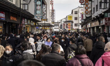 Shoppers are pictured here in the Guanqian Street shopping area in Suzhou