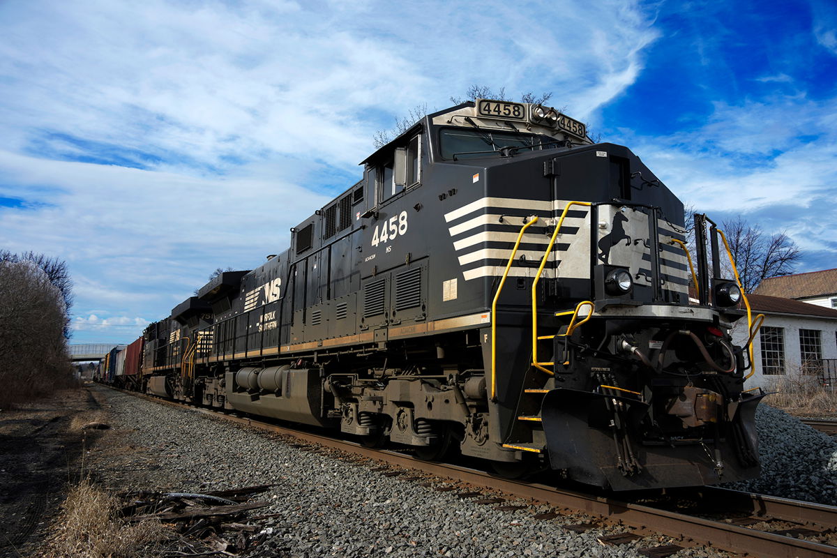 <i>Gene J. Puskar/AP</i><br/>A Norfolk Southern freight train passes through East Palestine