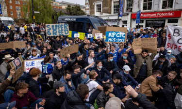 European Super League (ESL) organizers unveil a revamped competition with '60 to 80 teams.' Fans of Chelsea here protest against ESL on April 20