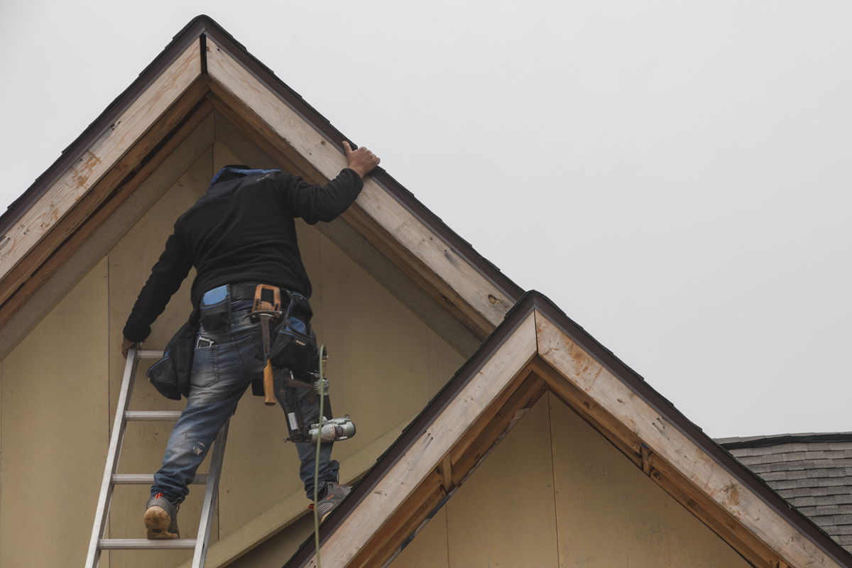 <i>Micah Green/Bloomberg/Getty Images</i><br/>New home sales rose in January from December. Pictured is a construction worker working on a new home in Foley