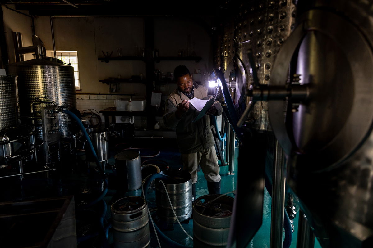 <i>Dwayne Senior/Bloomberg/Getty Images</i><br/>Businesses in South Africa have had to resort to torches and other sources of light during frequent power outages.