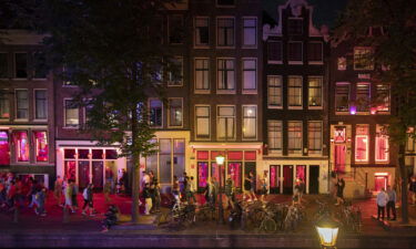 Sidewalks are often packed with tourists in the Red Light district in Amsterdam.
