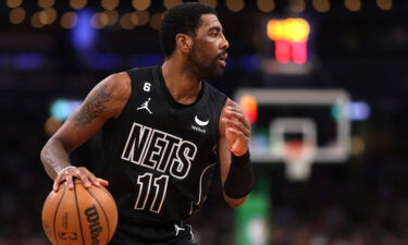 Kyrie Irving dribbles the ball while he plays for the Brooklyn Nets against the Boston Celtics on February 1 in Boston