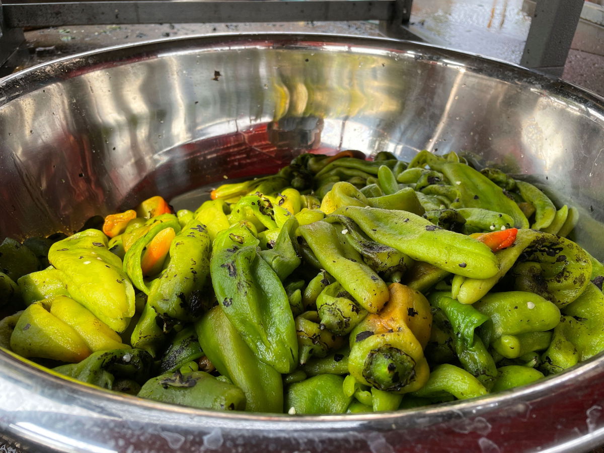 <i>Susan Montoya Bryan/AP</i><br/>A large bowl of roasted green chile at a market in Hatch