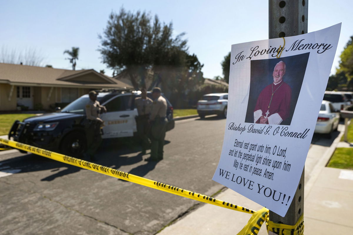 <i>Damian Dovarganes/AP</i><br/>Los Angeles County Sheriff deputies guard the entrance to the street of Bishop David O'Connell's home in Hacienda Heights