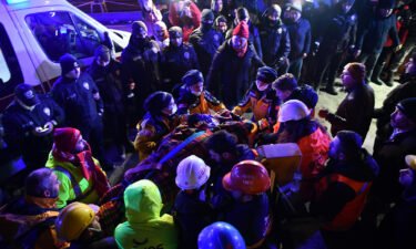 A family is rescued from the rubble of a collapsed building after 40 hours of search and rescue efforts on February 7 in Turkey.