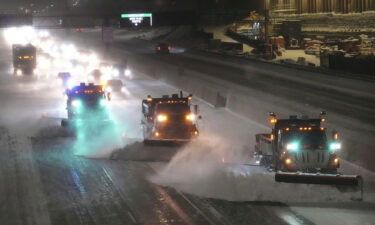 Plows move snow from I-35W southbound seen from the 42nd St. Bridge on Wednesday in Minneapolis.