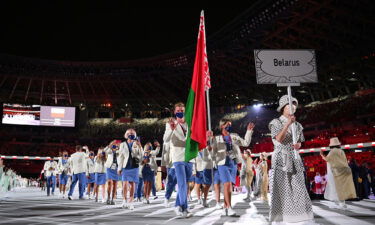 More than 30 countries are calling on the International Olympic Committee to ban Russian and Belarusian athletes from competing in international sports. Belarusian athletes here walk out at the opening of the Tokyo Olympics in July 2021.