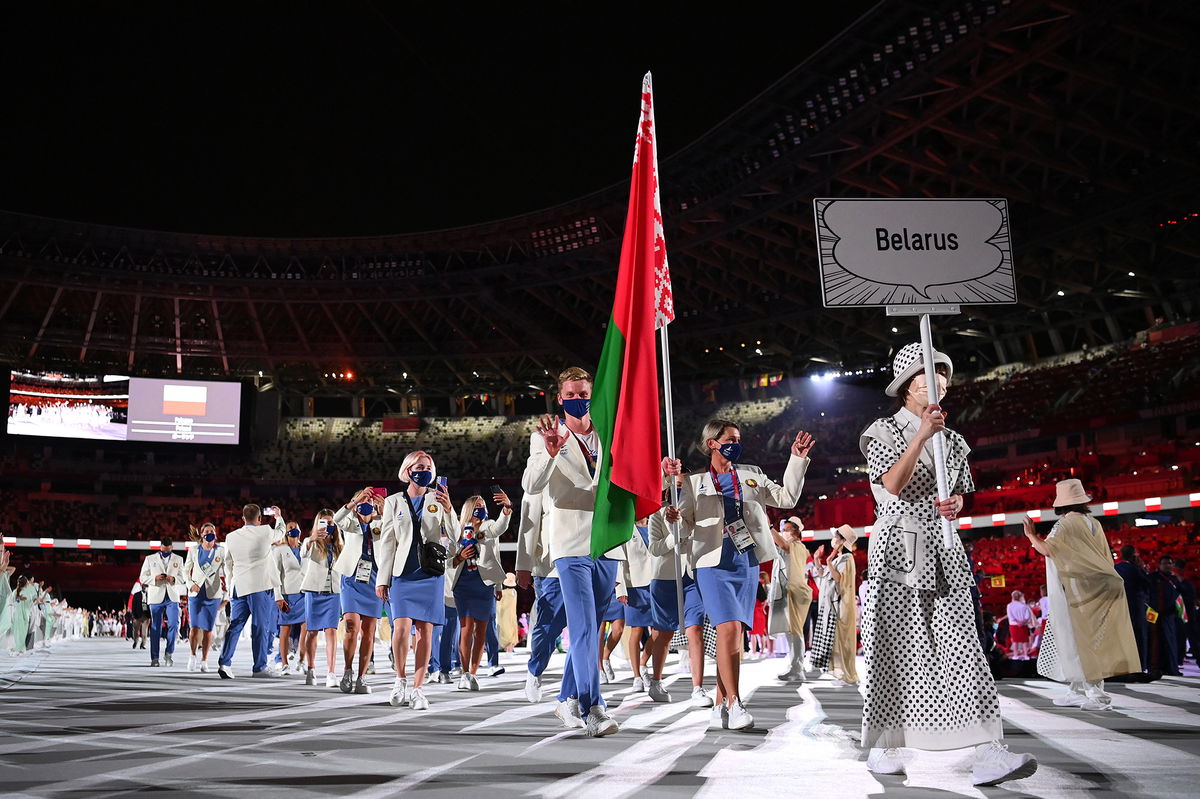 <i>Matthias Hangst/Getty Images</i><br/>More than 30 countries are calling on the International Olympic Committee to ban Russian and Belarusian athletes from competing in international sports. Belarusian athletes here walk out at the opening of the Tokyo Olympics in July 2021.