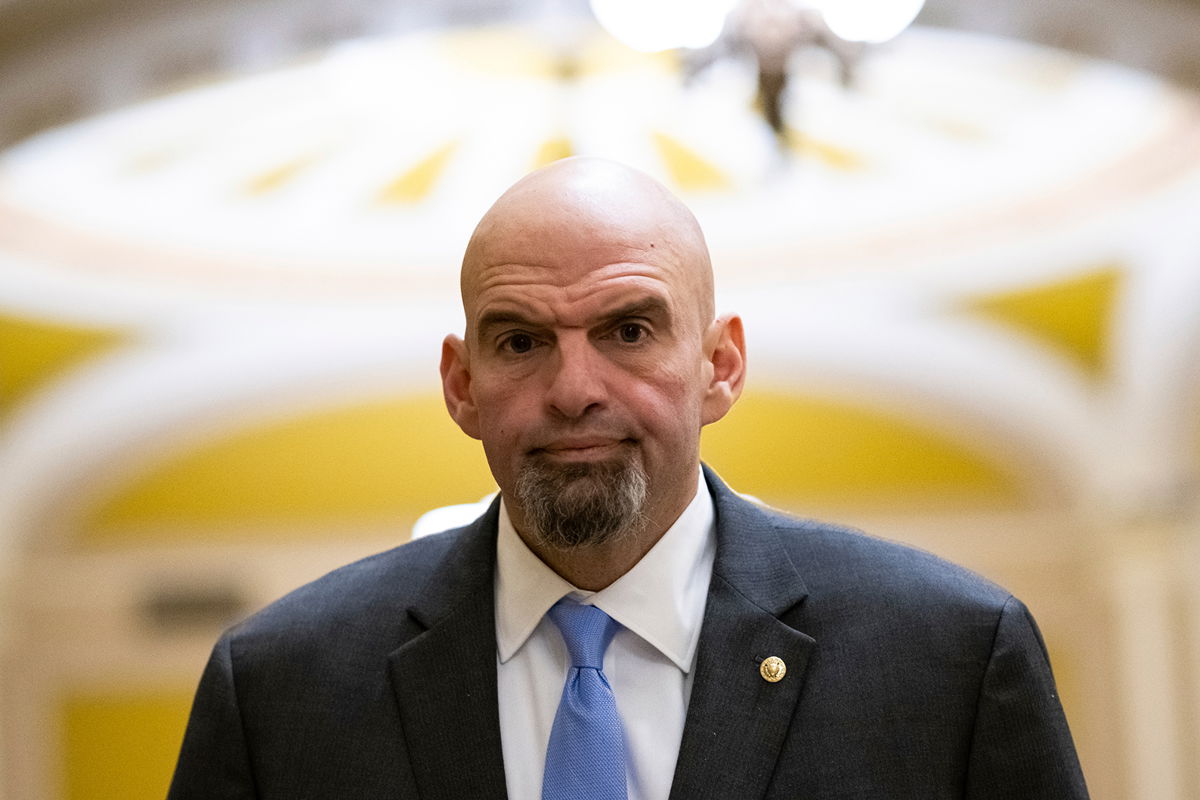 <i>Graeme Sloan/Sipa/AP</i><br/>Sen. John Fetterman walks