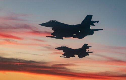 F-16 Fighting Falcons from Eglin Air Force Base fly over a high school football game in Niceville