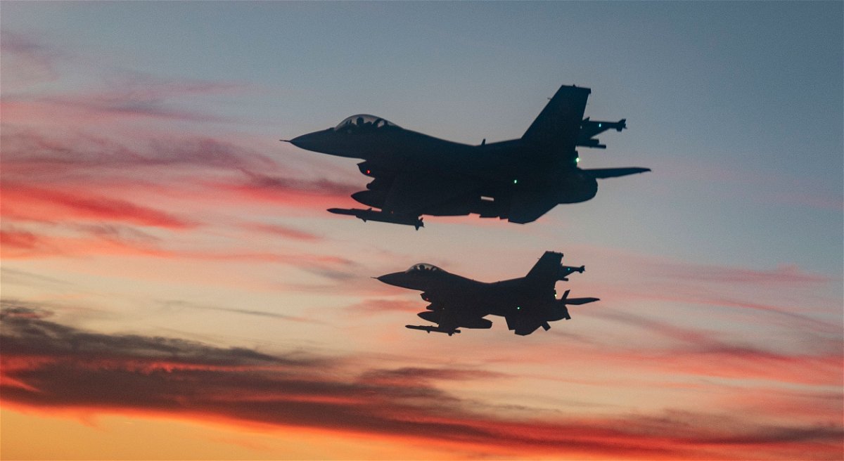 <i>Master Sgt. Tristan McIntire/40th Flight Test Squadron/DVIDS</i><br/>F-16 Fighting Falcons from Eglin Air Force Base fly over a high school football game in Niceville