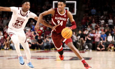 Brandon Miller (24) drives to the basket against South Carolina.