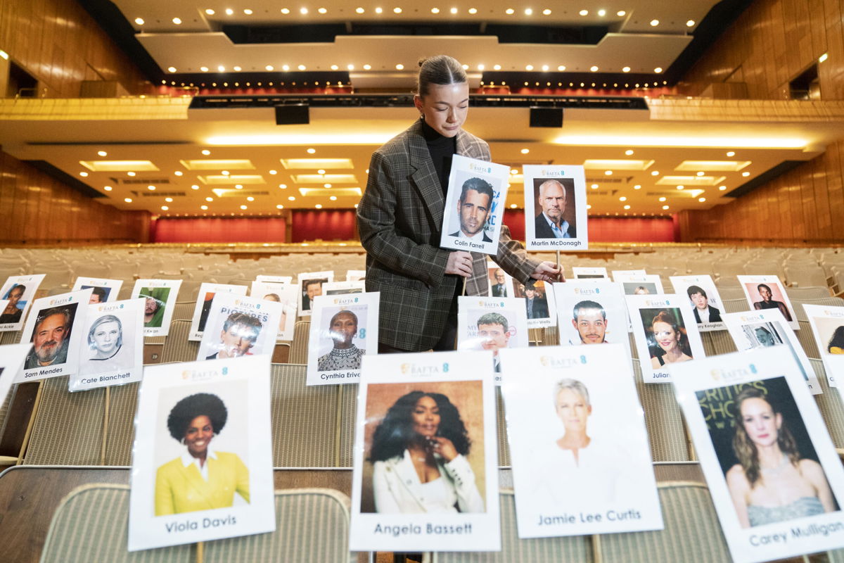 <i>Kirsty O'Connor/PA Images/Getty Images</i><br/>A staff member plots out nominee seating assignments ahead of the EE British Academy Film Awards