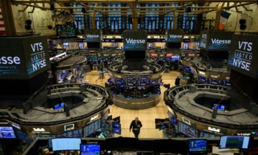 Companies have been eager to please Wall Street by repurchasing shares and boosting dividends for shareholders. Pictured is the New York Stock Exchange on January 18.