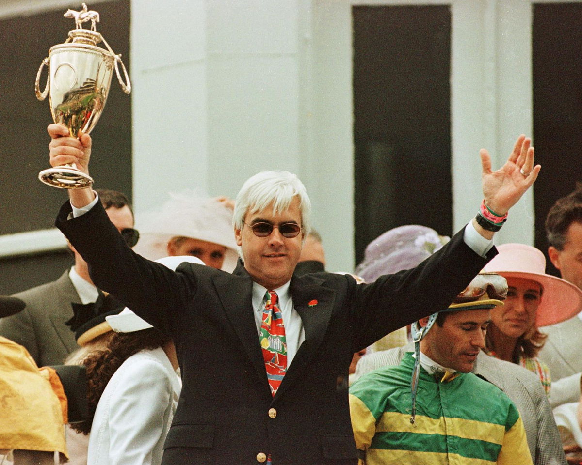 <i>ROBERT SULLIVAN/AFP/Getty Images</i><br/>Trainer Bob Baffert holds up the Kentucky Derby Trophy to celebrate the win of Silver Charm at the 123rd Kentucky Derby at Churchill Downs in Louisville in May 1997. Silver Charm won in a photo finish over Captain Bodgit. Next to Baffert is winning jockey Gary Stevens (R).