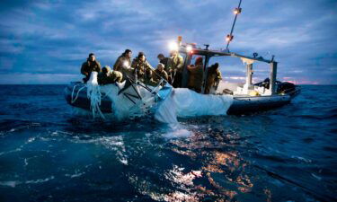 Sailors assigned to Explosive Ordnance Disposal Group 2 recover a high-altitude surveillance balloon off the coast of Myrtle Beach