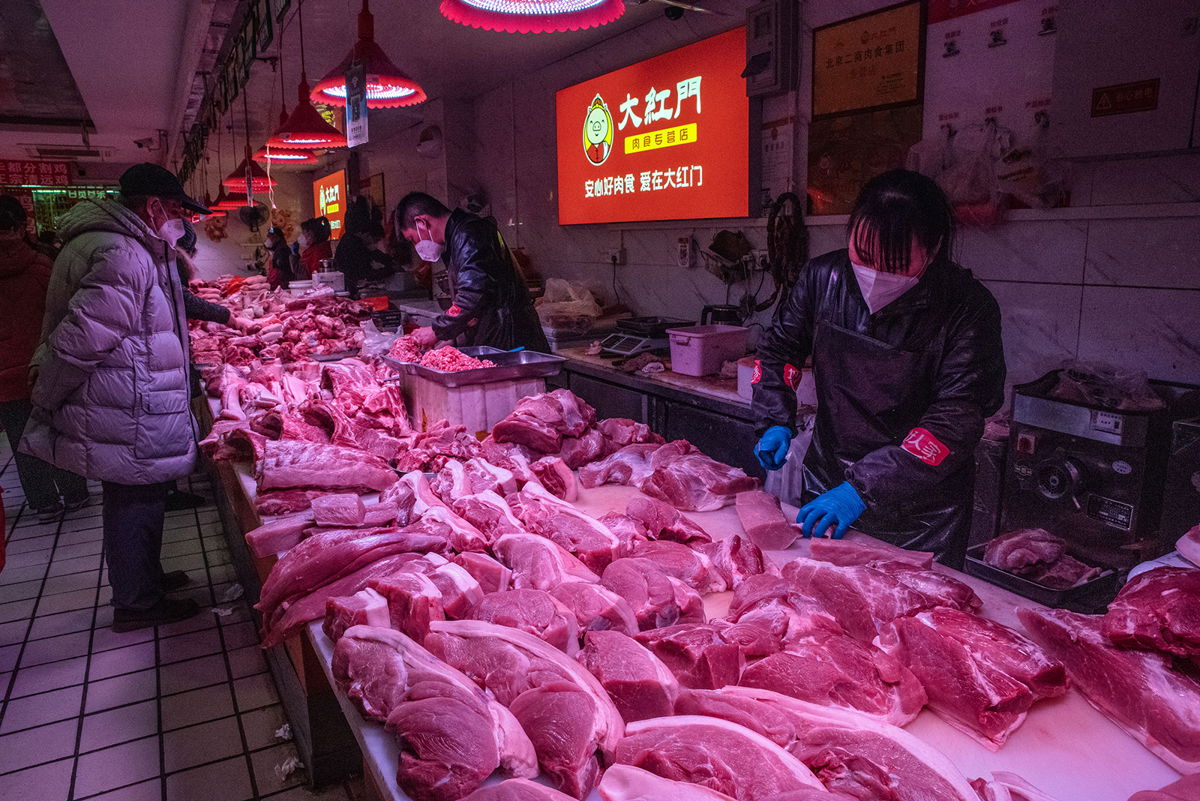<i>Bloomberg/Getty Images/File</i><br/>Beijing will give out a $6 monthly cash subsidy to offset inflation. Pork is for sale at a wholesale market in Beijing on January 12.