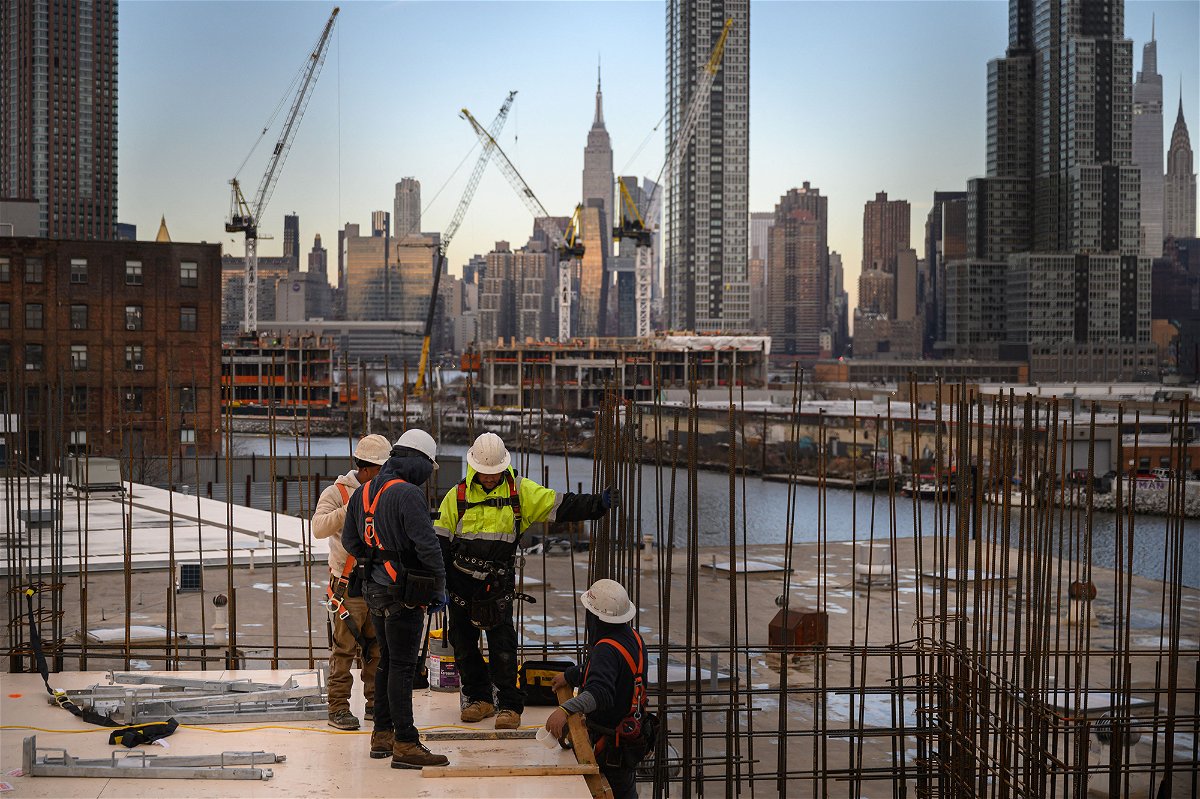 <i>Ed Jones/AFP/Getty Images</i><br/>Construction workers are pictured here in Brooklyn on January 24.