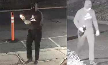 A masked suspect is seen lighting a Molotov cocktail in front of the synagogue in a still image from surveillance footage in Bloomfield