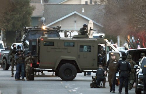 Law enforcement officers are seen here during a standoff with the kidnapping suspect in Grants Pass