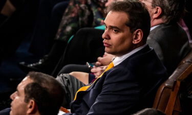 The Democrats are launching a new effort to link vulnerable New York Republicans to Rep. George Santos - pictured here at President Joe Biden's State of the Union address on February 7.