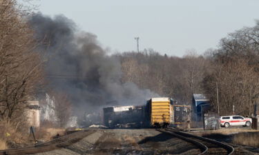 Smoke rises from a derailed cargo train in East Palestine