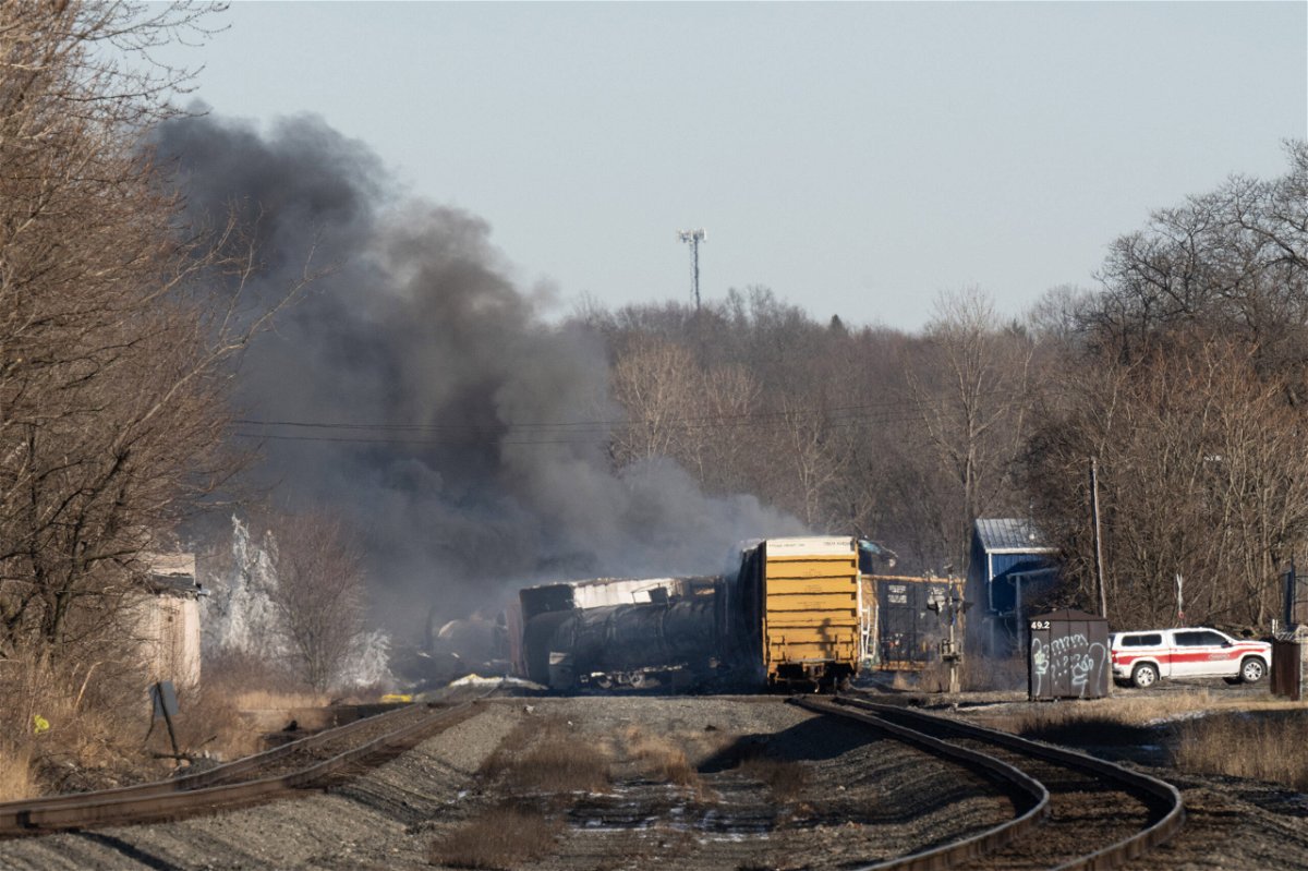 <i>Dustin Franz/AFP/Getty Images</i><br/>Smoke rises from a derailed cargo train in East Palestine