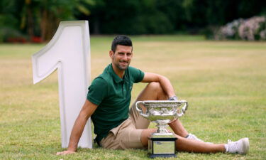 Novak Djokovic poses with the trophy after winning the Australian Open earlier in 2023.