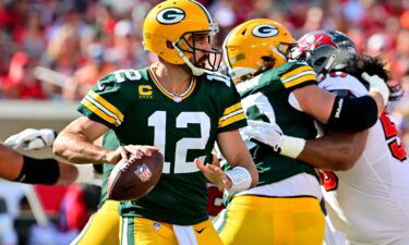 Aaron Rodgers #12 of the Green Bay Packers looks to throw a pass against the Tampa Bay Buccaneers in Tampa