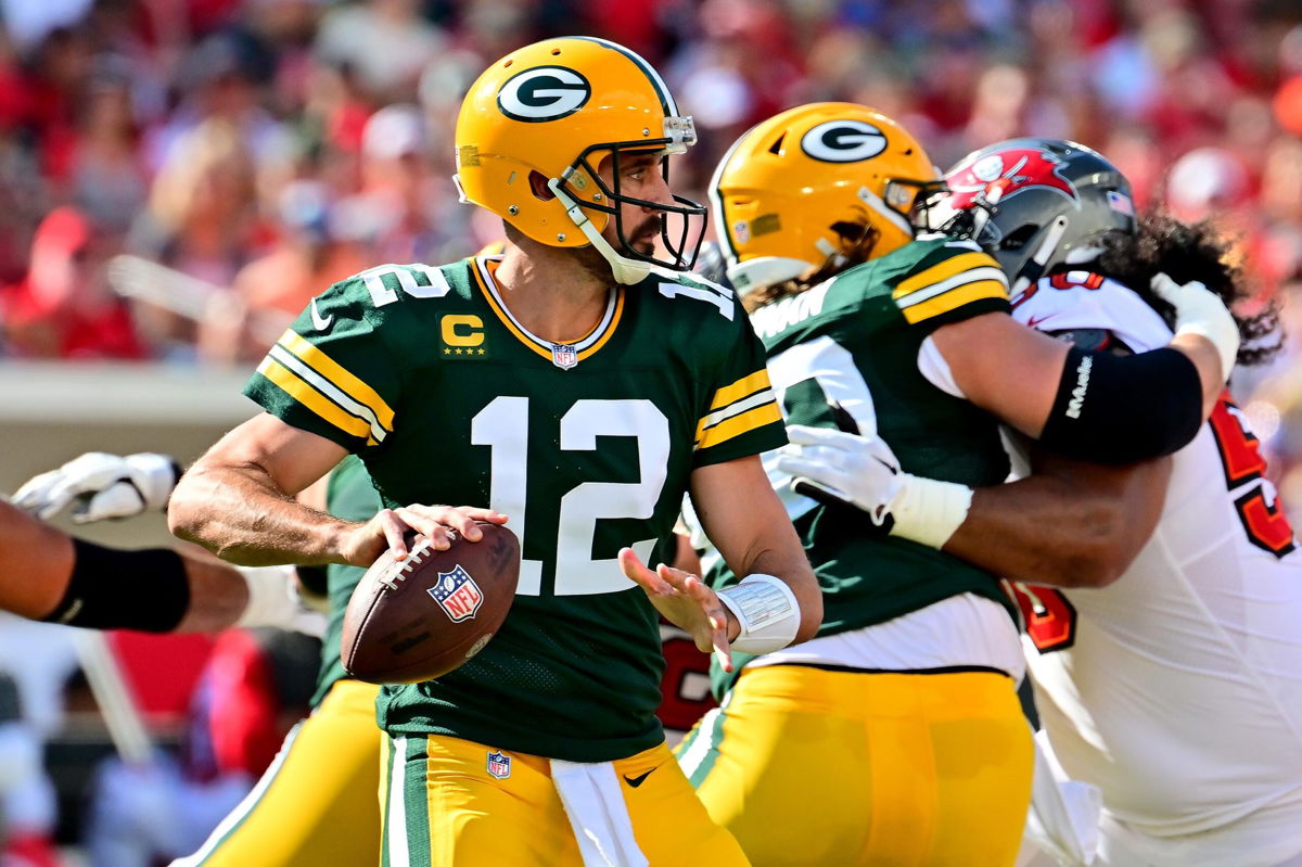 <i>Julio Aguilar/Getty Images</i><br/>Aaron Rodgers #12 of the Green Bay Packers looks to throw a pass against the Tampa Bay Buccaneers in Tampa