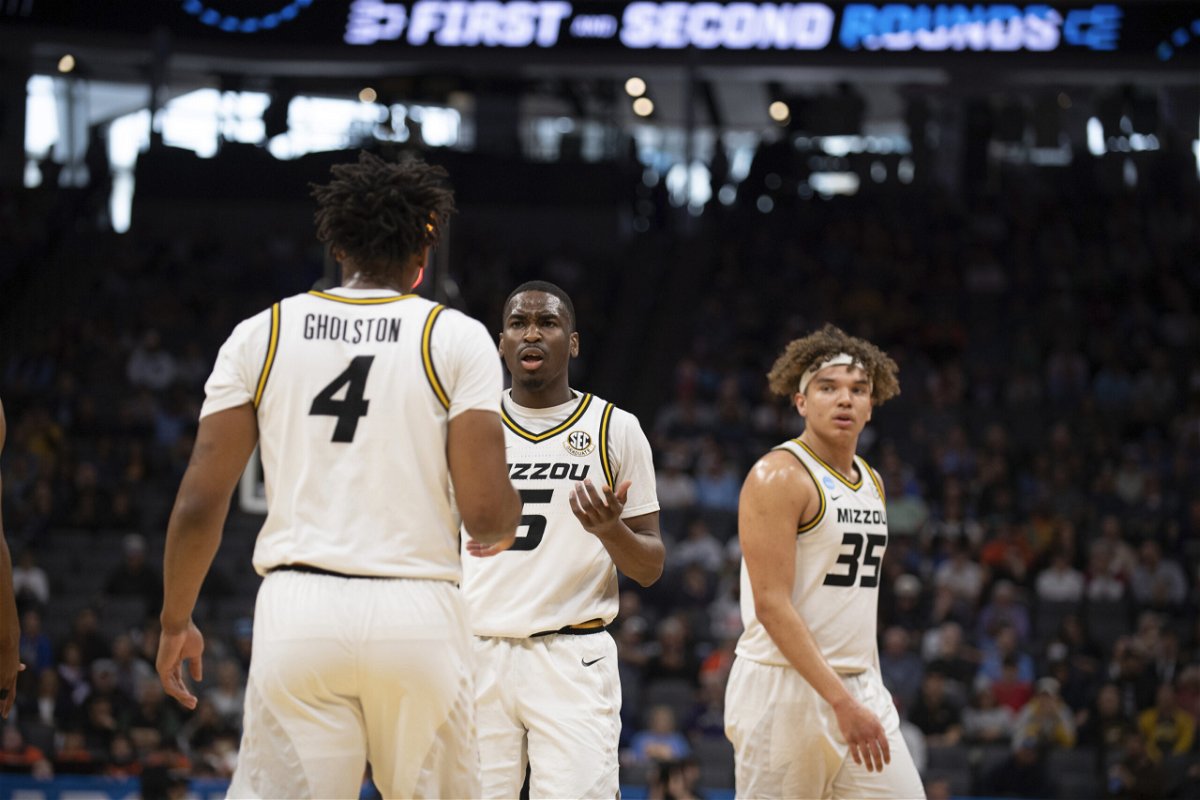Missouri guard D'Moi Hodge (5) talks with guard DeAndre Gholston (4) as forward Noah Carter (35) listens during a timeout in the first half of the team's second-round college basketball game against Princeton in the men's NCAA Tournament, Saturday, March 18, 2023, in Sacramento, Calif.